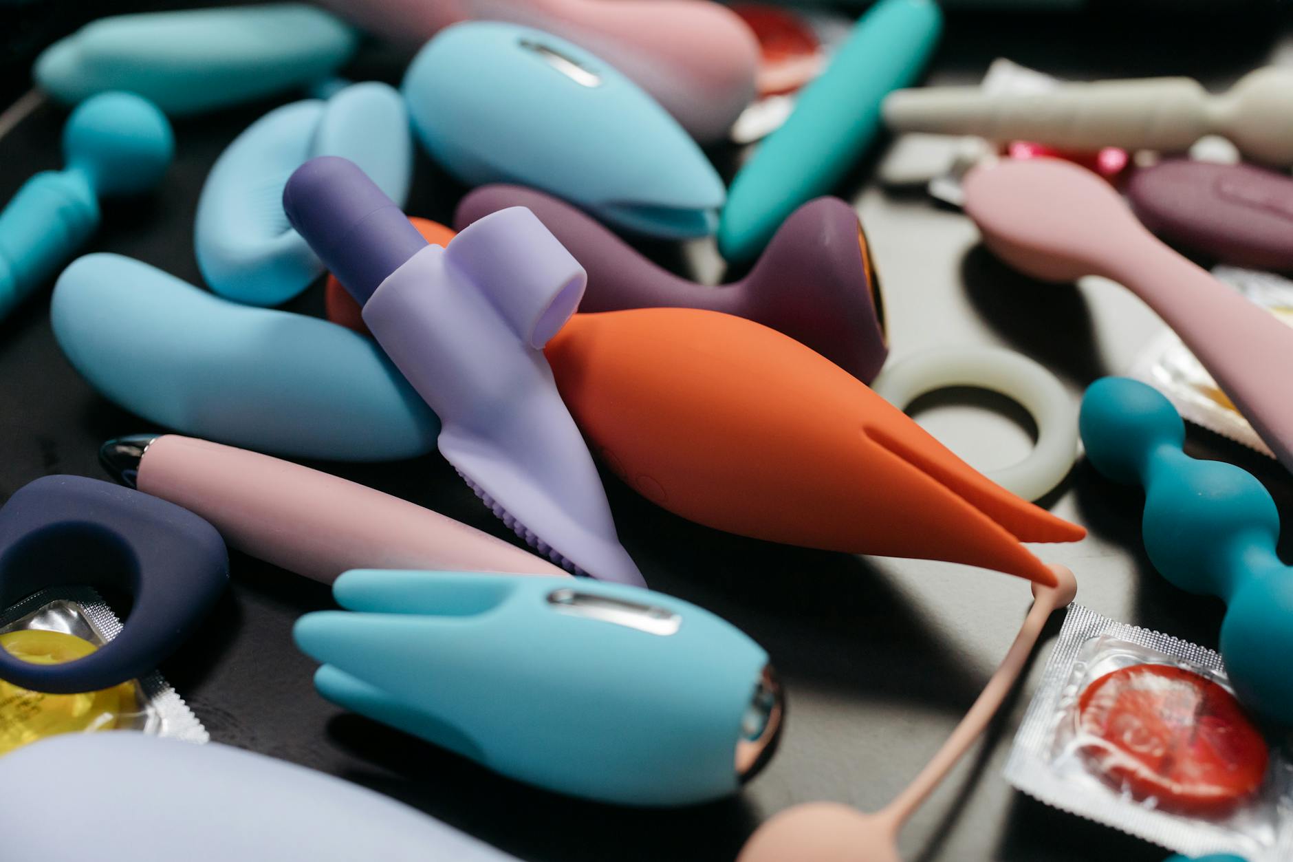 An array of vibrant adult toys including lemon vibrators in a close-up view